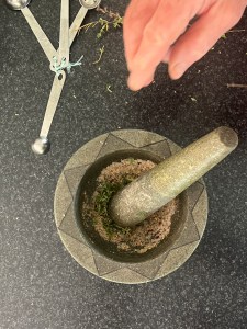 Spices for salmon in a mortar and pestle